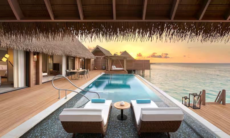 Overwater Villas mleonwa-grand-reef-villa-at-dusk